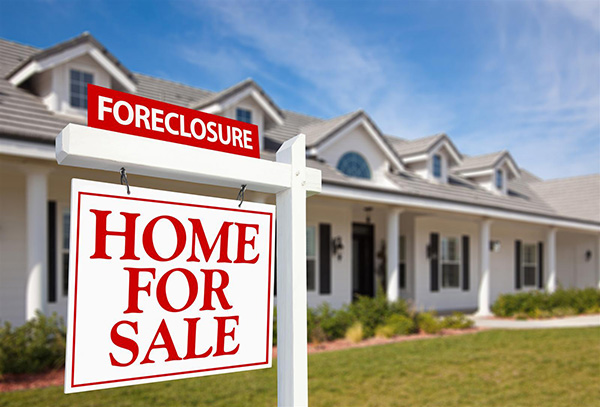 Foreclosure sign outside house in Colorado